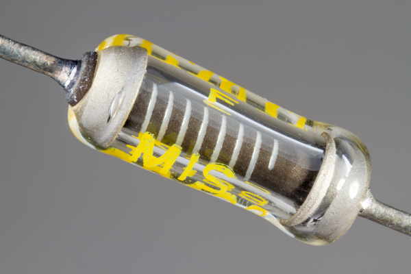 A vintage glass-encapsulated precision film resistor